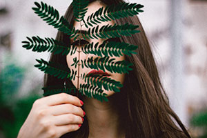 Woman Behind Fern, a photo by Allef Vinicius from Upsplash.